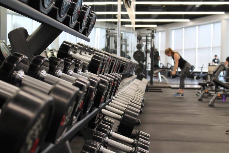 Photo by Danielle Cerullo via Unsplash a rack of weights at the gym