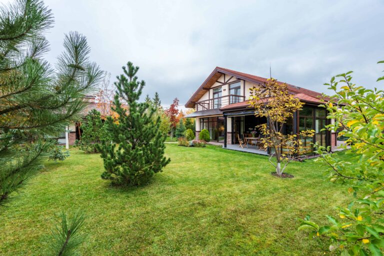 Photo by Max Rahubovskiy via pexels cottage with veranda and trees growing in backyard