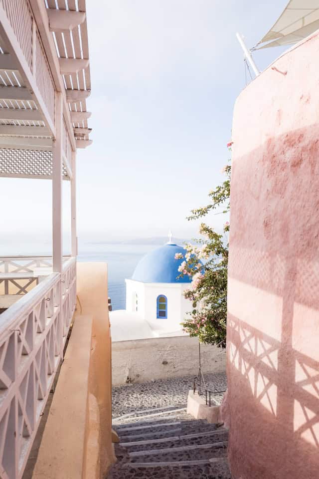 Julian Paul via Unsplash photo between smooth surface buildings similar to greece